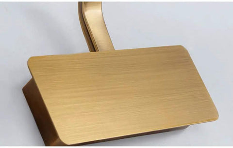 Close-up of Lit Vanity Light With Brushed Brass Arc Arm Sconces Long Acrylic Linear Wall Light in gold showing brass arm detail