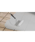 Applying Two Step Home Floor Watercolor Coating Kit White With Easy Diy Application over tile using a paint roller