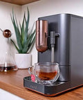 Top Shelf Wifi Automatic Espresso Machine With Built In Milk Frother And Adjustable Bean Grinder One Touch Brew In Under Ninety Seconds Matte Black on a kitchen counter.