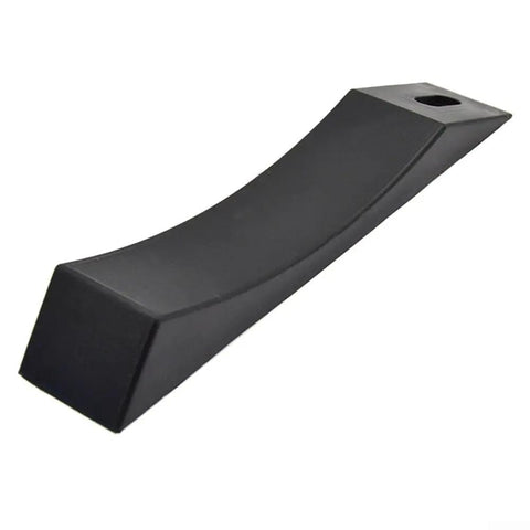 Close-up of a black silicone wedge block, part of the Two Pack Silicone Deadlift Wedge Blocks For Secure Barbell Plate Loading And Unloading
