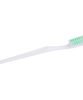 White toothbrush with green bristles on a plain background, ideal for daily dental hygiene routines.