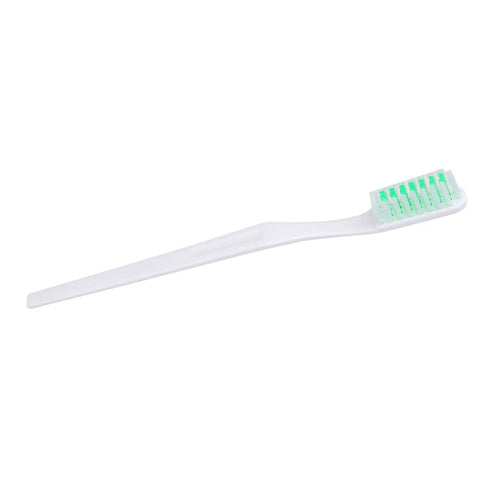 White toothbrush with green bristles, designed for effective teeth cleaning and oral hygiene.