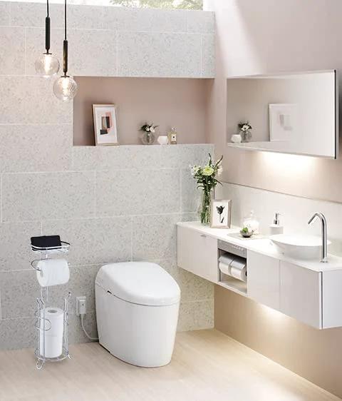 Bathroom with Free Standing Chrome Toilet Paper Holder With Reserve Shelf And Storage Basket next to modern sink