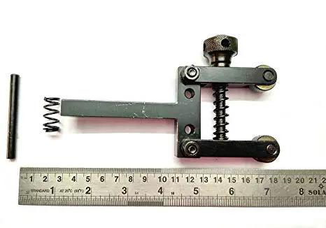 Spring Loaded Clamp Type Knurling Tool With Two Inch Capacity And Three Eighths Inch Shank For Lathes with a ruler for scale.