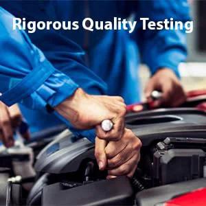 Mechanic performing rigorous quality testing on car engine in garage setting