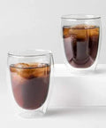 Set Of Six Double Wall Insulated Glass Tumblers Twelve Ounce Capacity Heat Resistant Borosilicate Construction Clear Look filled with iced coffee.