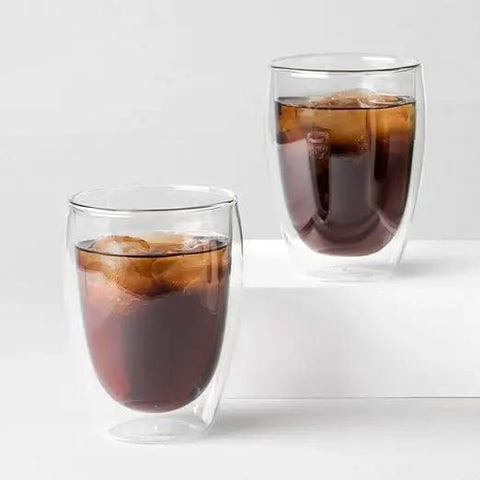 Set Of Six Double Wall Insulated Glass Tumblers Twelve Ounce Capacity Heat Resistant Borosilicate Construction Clear Look filled with iced coffee.