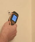 Person using SurveyMaster Dual Function Moisture Meter With Pin And Non Invasive Modes Reads Wood Drywall Concrete And Fiberglass Boat Hulls