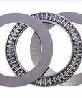 Front view of three AXK2542 thrust needle roller bearings with washers; steel, 25mm bore, 42mm OD, 2mm width