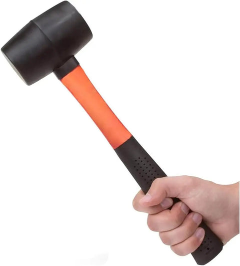 Hand holding 16 Oz Rubber Mallet Hammer With Fiberglass Handle And Shock Absorption Soft Blow Hammer For Flooring Tent Stakes Woodworking Camping And DIY Projects Ergonomic Non Slip Grip
