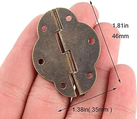 Oval Box Hinge Set 46x35mm 6 Hole Lace Antique Furniture Hardware held in hand showing 46mm and 35mm dimensions