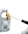 Silicone O-ring being fitted onto brass valve with pick and hook (VMQ, 4–32 mm)