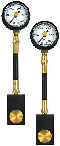 Disc brake system analyzer gauges, pair; black handles with brass fittings, front view.
