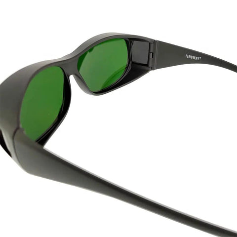 Wrap Around Welding Glasses Featuring Grippy Strap And Scratch Resistant Lenses For Laser Hair Removal Safety Plus UV Blocking Eye Shield showing green tinted lenses and sleek frame design.