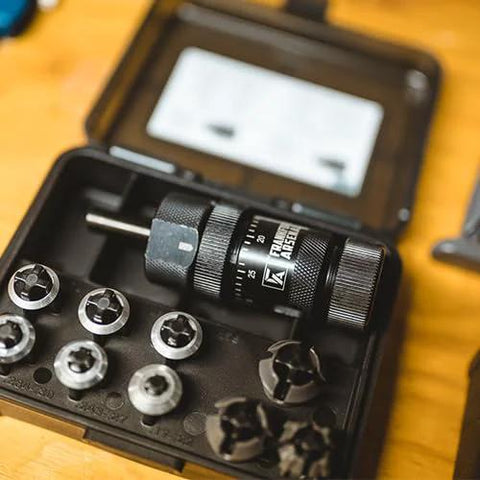 Frankford Arsenal universal precision case trimmer set with HSS chuck in a black storage case and assorted collets.