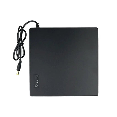 Compact Mini UPS Battery Backup For 12 Volt Routers Cameras And Speakers Emergency Standby Power Supply with black casing and power cable.