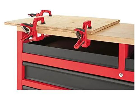 Beefy 52 Inch Mobile Workbench With 11 Soft Close Rollout Drawers And Thick Hardwood Counter Top showing clamps securing plywood.