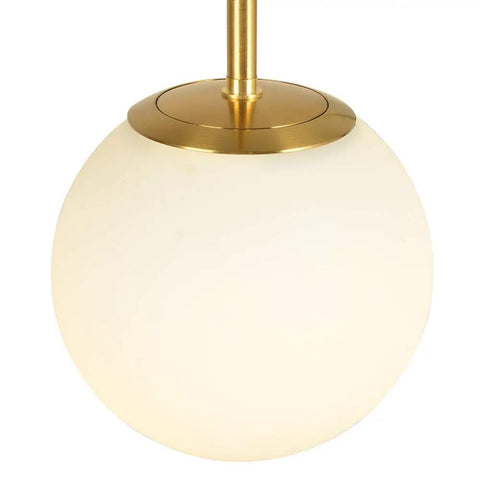 Lit Globe Pendant Light With Matte White Glass And Brass Finish, close-up of light fixture showcasing round design