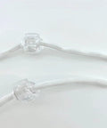 Close-up of Roman Shade Orbs Lock Rope Buckle Kit for Easy Leveling of Window Treatments, transparent with adjustable rope.