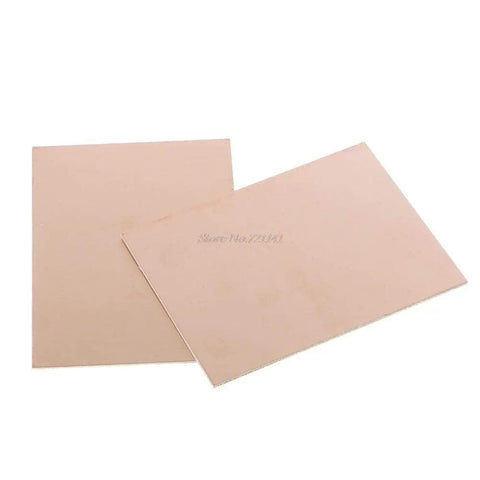 10 Pack FR4 Glass Fiber Copper Clad Laminate PCBs, Double Sided Printed Circuit Boards 100x75x1.5 mm, two sheets shown.