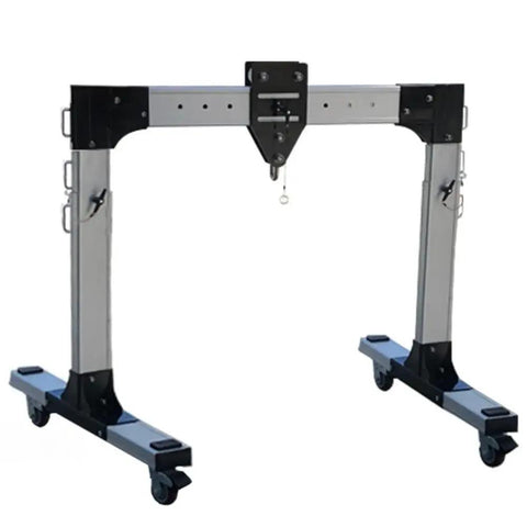 Real Deal Portable Gantry Crane With Electric Winch And Chain Ratchet designed for lifting in workshops, featuring adjustable aluminum legs.
