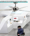 Slick Remote Control Ceiling Fan With Five Sleek Blades And Hella Quiet Operation For Serious Air Moves Modern Black Stainless Steel Design shown in a modern office space.