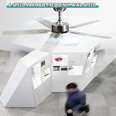 Slick Remote Control Ceiling Fan With Five Sleek Blades And Hella Quiet Operation For Serious Air Moves Modern Black Stainless Steel Design shown in a modern office space.