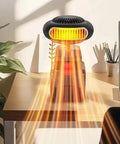 Rock Solid 170W Portable Space Heater With Smart Thermostat delivering heat on a wooden desk with plants and a laptop.