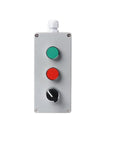 Push-button control box, front view, silver metal with green start button, red stop button, and black rotary knob.