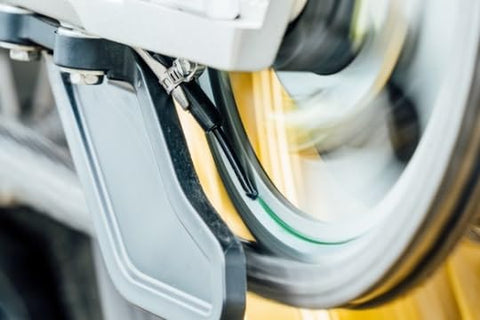 Essentials Micro XSystem 3.0 Plus Electronic Automatic Motorcycle Chain Lubrication System installed on bike wheel