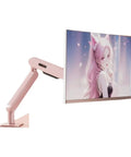 Industrial Grade Wall Mounted Monitor Arm Hella Adjustable Full Motion Extending Desk Stand mounted in pink with monitor display.