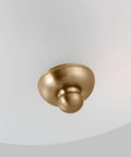 Close-up of Satin Brass 3 Light Flush Mount Ceiling Light In Geary Style, showing brass mount and etched glass.