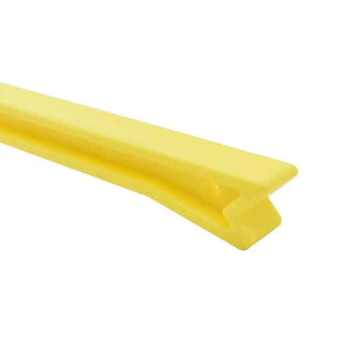 Close-up of yellow ergonomic push stick for table saw and router table, featuring contoured handle and thumb rest for safer guiding.