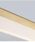 Close-up of Modern Brushed Brass Vanity Wall Light With Arc Arm Sconces, Long Acrylic Linear LED Bath Lighting, Warm 2700K Glow.