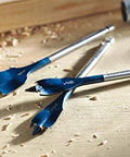 Group of blue Daredevil spade bits on a wood workbench; 1 in x 6 in, three pieces.