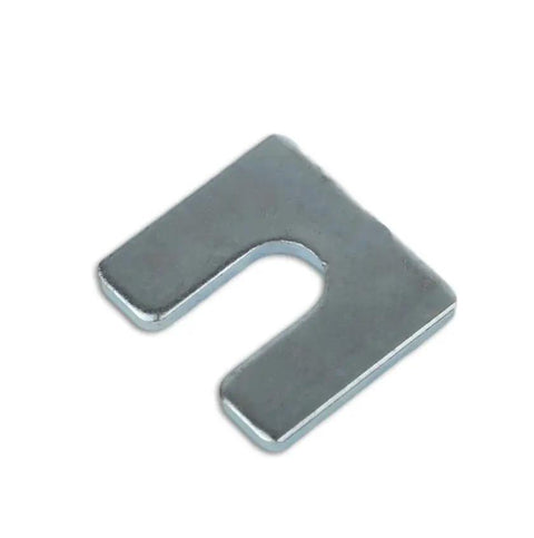 Close-up of a 1/8 inch steel shim with a 3/8 inch slot. Part of the Beefy One Eighth Inch Steel Shim Stock With Three Eighth Inch Slot Width Pack
