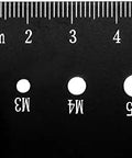 Thread pitch gauge, black metal with metric scale and M3, M4, M5 holes (close-up)