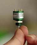 Hand holding Compact Contactless Hall Effect 360 Degree Angle Sensor Encoder With 3mm Shaft And 15mm Outer Diameter