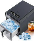 Real MVP Nugget Ice Maker Countertop Model With Self-Cleaning Function, pulling out basket full of chewable ice cubes.