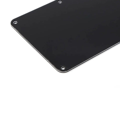 Close-up of black Electric Guitar Back Plate Cover with 6-hole plastic cavity backplate closed style for repair and refit.