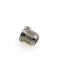 Close-up of a metal 8mm through-body string ferrule bushing with knurled exterior, rear-mount for electric bass guitar
