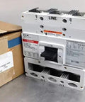 CLD3600F Heavy Duty Circuit Breakers Drop Straight Into Any Panel red tripping mechanism alongside a box, industrial grade design.