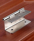 Zinc alloy hinge from Ten Pcs 59mm Three Folding Cabinet Door Hinges Set For Vintage Furniture And Jewelry Boxes, resting on wooden surface