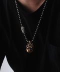 Beating Mechanical Heart Pendant Necklace Steampunk Style Jewelry With Gears And Vascular Details on model black shirt