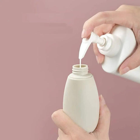 Filling a bottle from the Grab And Go Leak Proof Travel Bottle Set Of 3 60 Ml Refillable Squeezable Containers.