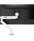 Heavy Duty Single Monitor Desk Mount With Slick Matte Finish And Zero Sweat Install For Your Work From Home Station Or Gaming Rig Featuring Sturdy Clamp And Smooth Pivot Tilting, with white support arm behind a black monitor.