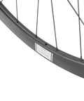 Close-up of Carbon Disc Brake Wheelset 700c 50mm By 25mm Tubeless Ready For Road Biking Paint Free Finish Toray T700 Fiber EN Certified