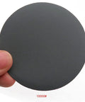 Top Shelf 30 Pack 3 Inch Hook Loop Sanding Discs Waterproof Silicon Carbide Rounds 60 To 10000 Grit Wet Dry Sandpaper For Steel Wood Glass Deburring That Gets It Done Fast - 10000 grit sanding disc held in hand.