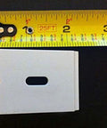 Three Duette Brackets For Applause And Duette Shades By Hunter Douglas with one and three-eighths inch wide shown with tape measure