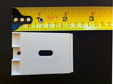 Three Duette Brackets For Applause And Duette Shades By Hunter Douglas with one and three-eighths inch wide shown with tape measure